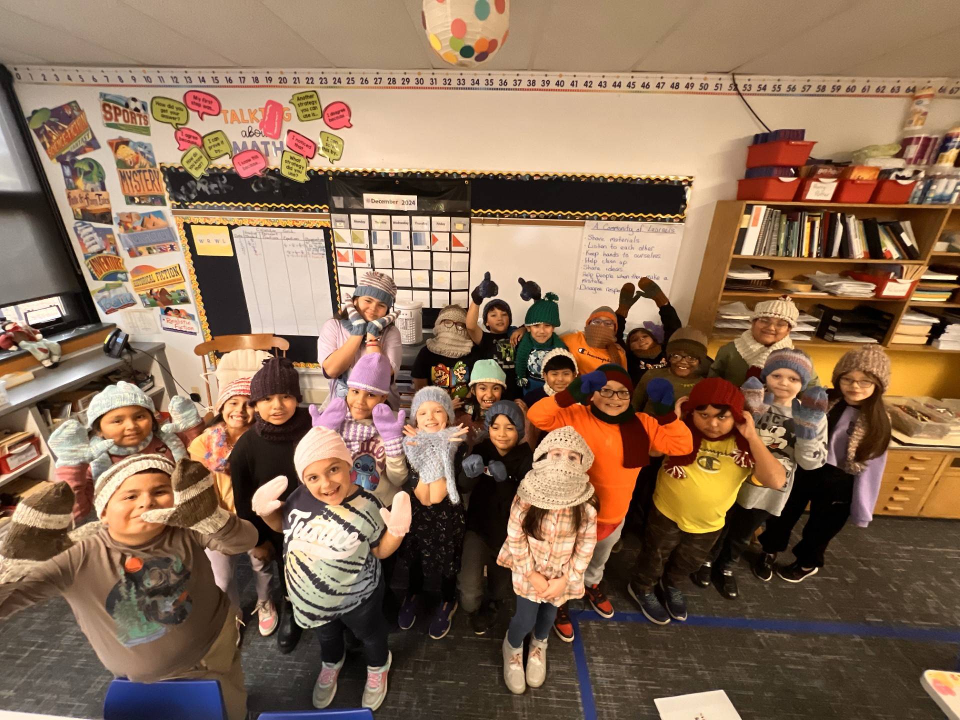 Children at Elementary School wearing their Interfaith and Interwoven knitted items